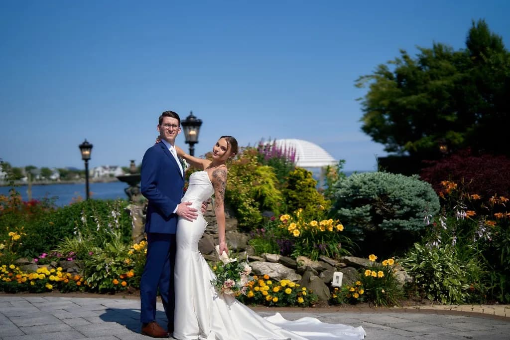 Bride opening ornate iron doors inside the Riviera Waterfront Mansion