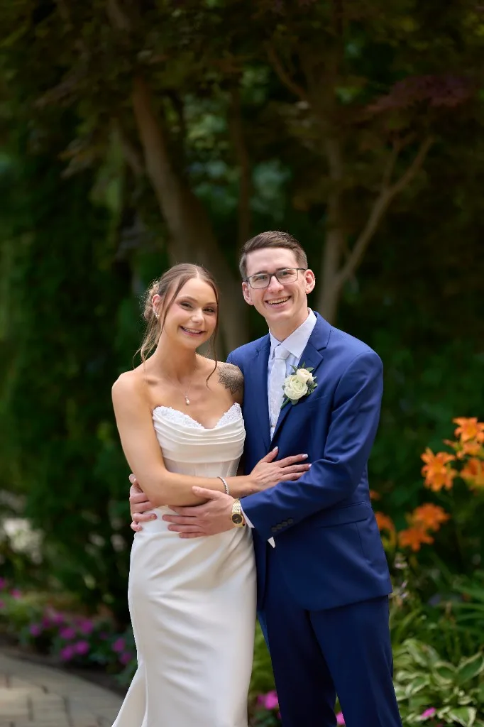 Hotels and Inns on Long Island, Groom waiting on the garden path as the bride walks toward him for their first look at the Riviera